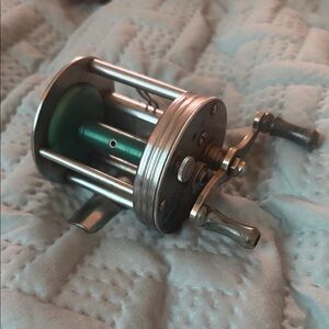Ocean City Inter-State Round Fishing Reel with Green Jewel